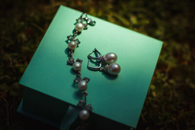 Earring Jewellery Lies on a mint packaging box