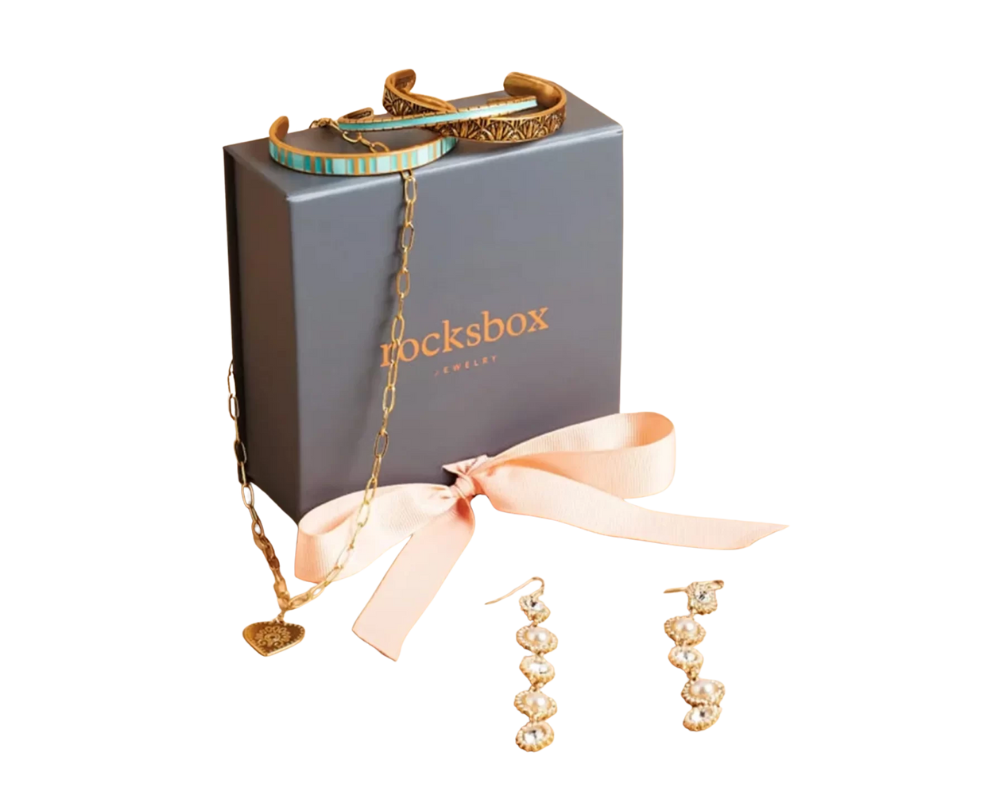 Premium jewellery box showcases a stunning necklace, matching bracelet, and elegant earrings outside.